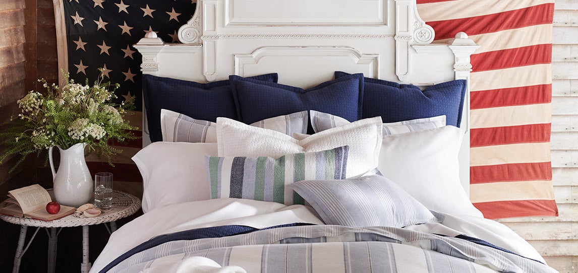 Bed with red, white & blue sheeting